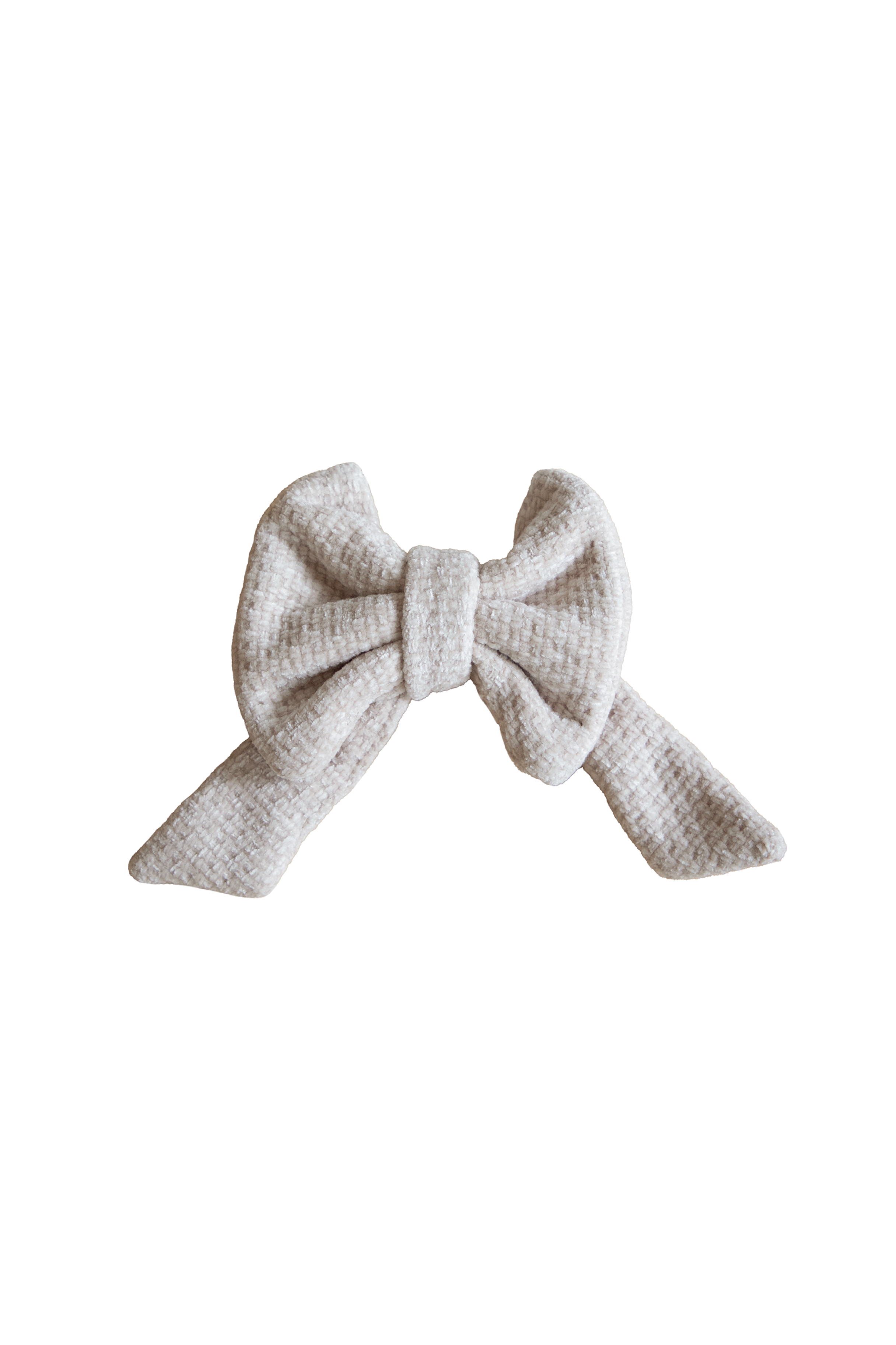Lille tekstil sløjfe i beige.