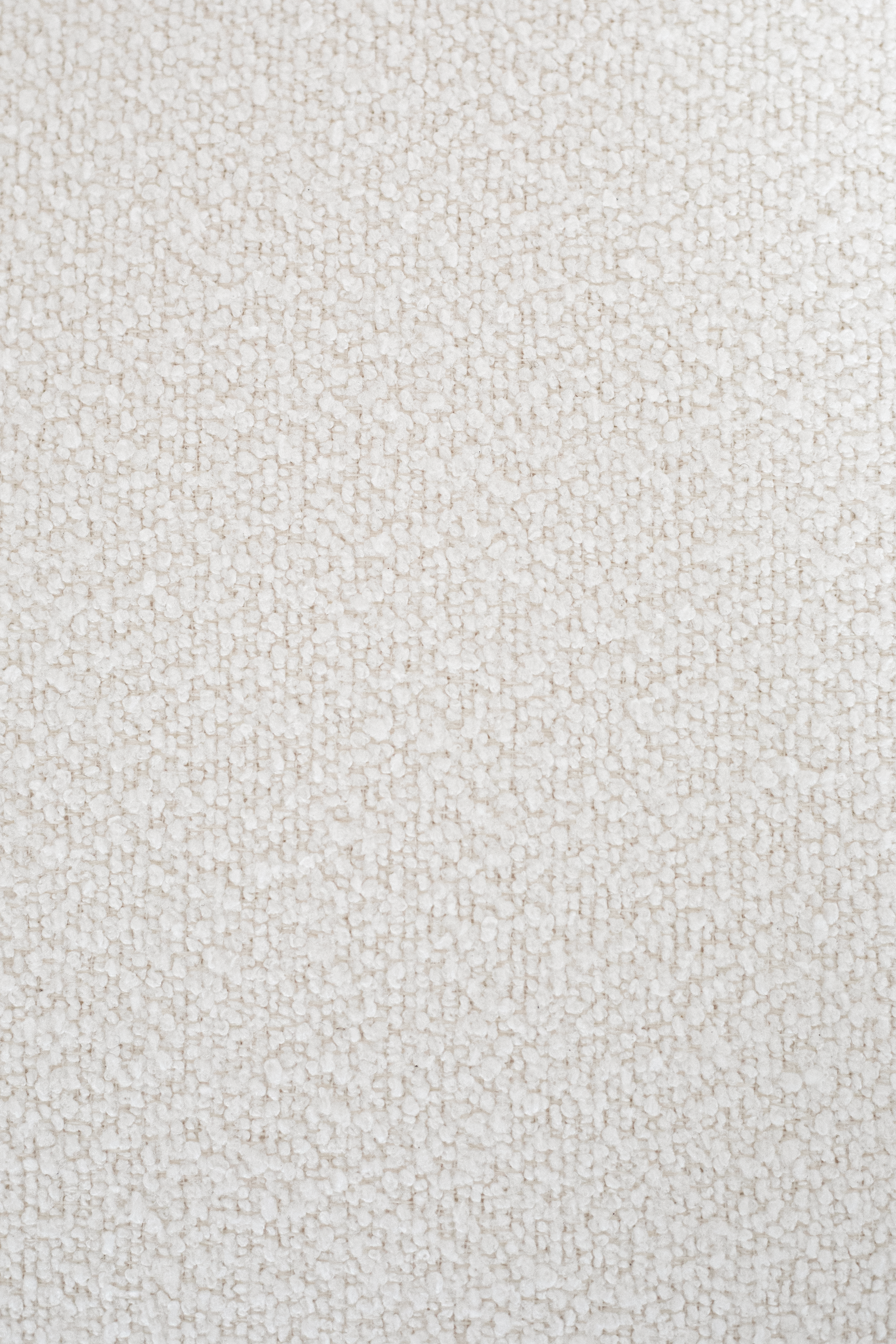 Detalje billede af hvid bouclé stof fra Specktrums Olivia loungestol