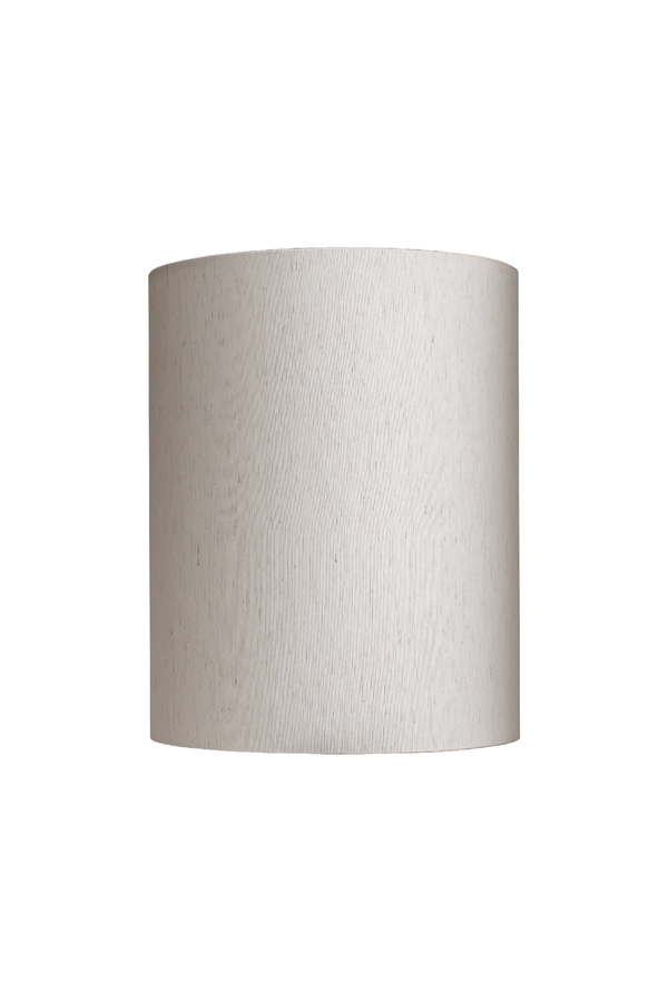 Et cylindrisk lampeskærm i lys beige farve med let tekstur, fotograferet mod en hvid baggrund. Skærmen har en glat overflade og ensartet form uden yderligere detaljer.