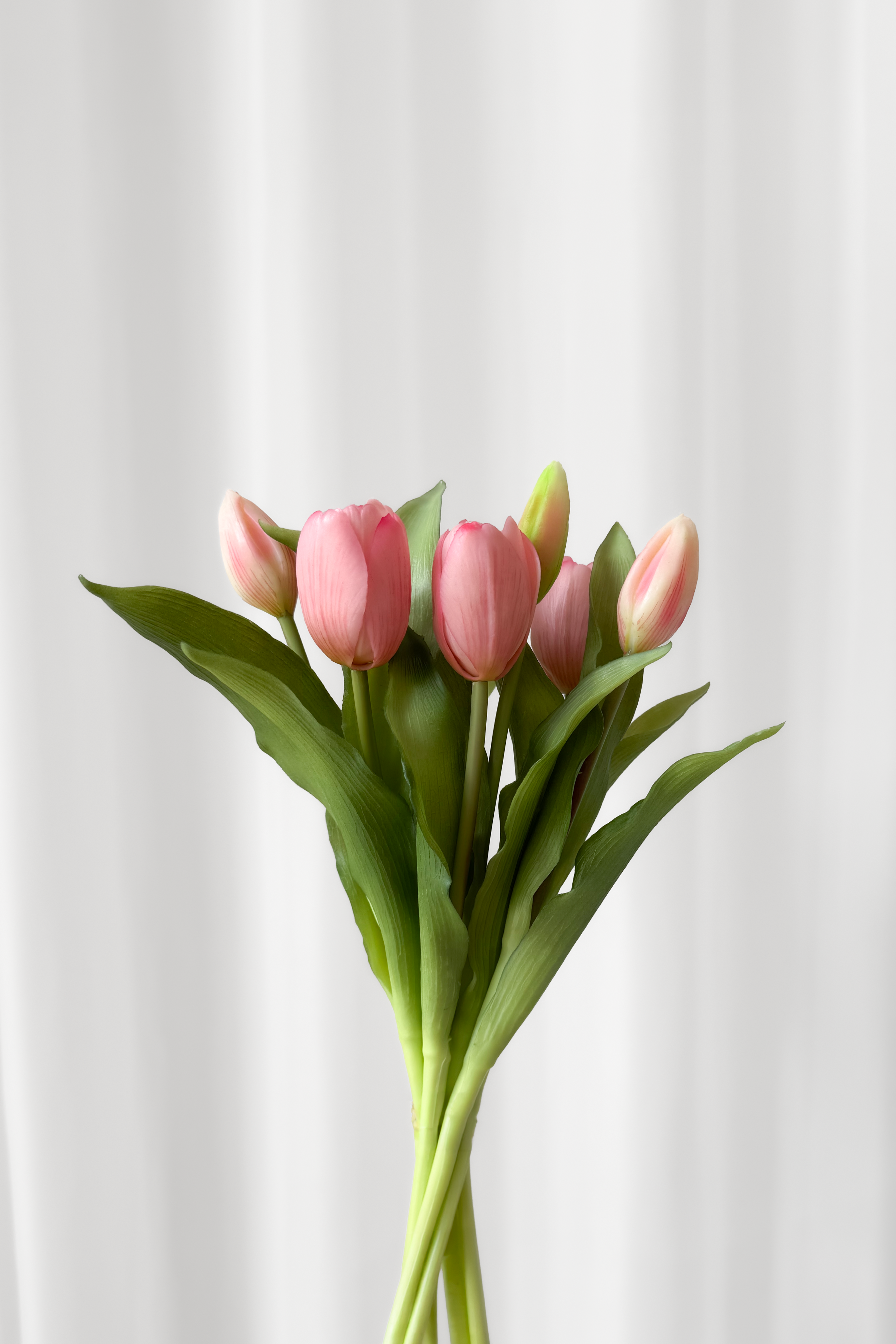 Bundt af tulipaner i rosa nuancer.